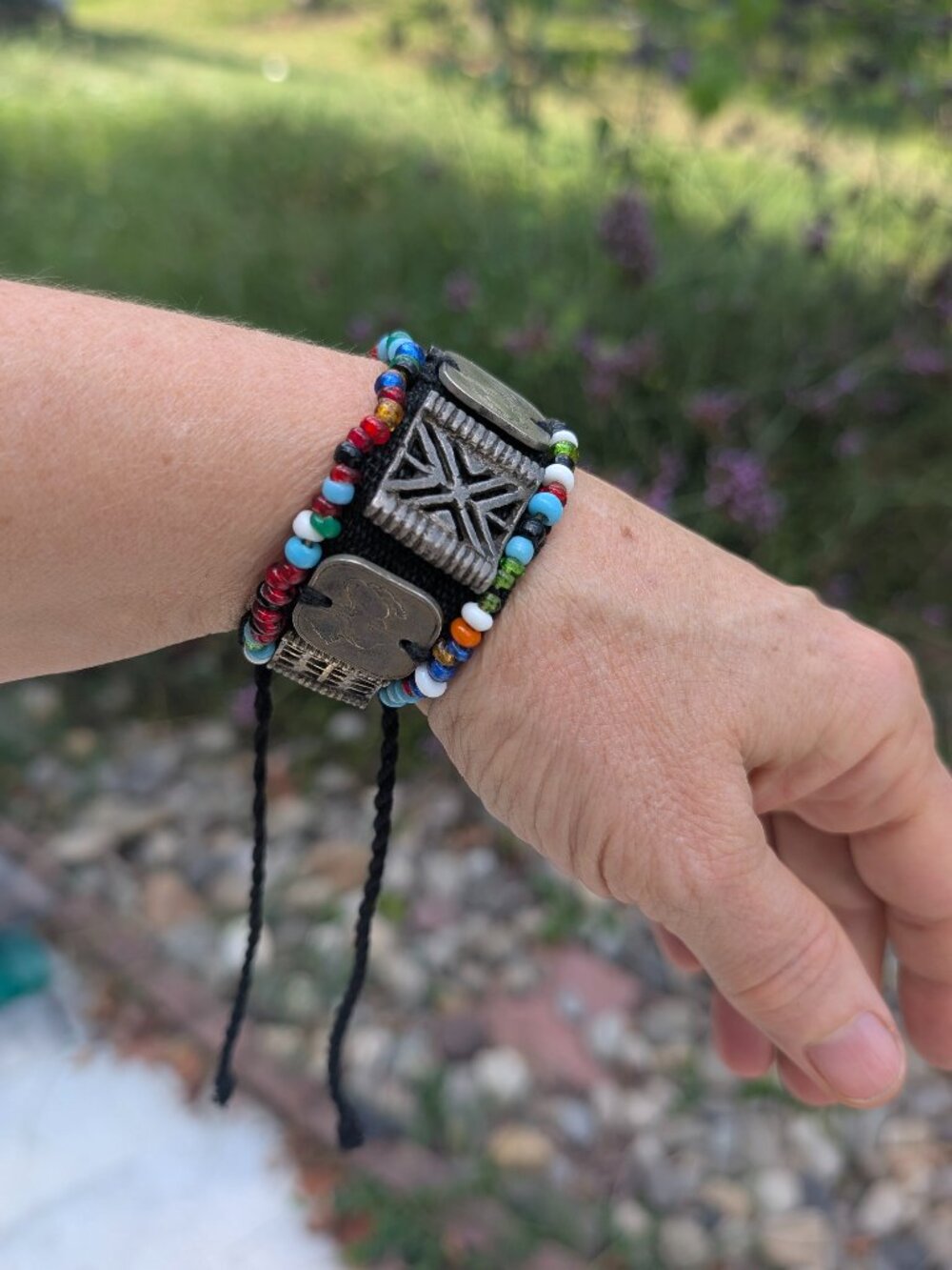Bracelet with multicolor beads, antiqued silver-tone animal